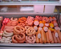 Sausages. Opening the department.  Formation of assortment in the department How to decorate a display case with sausage